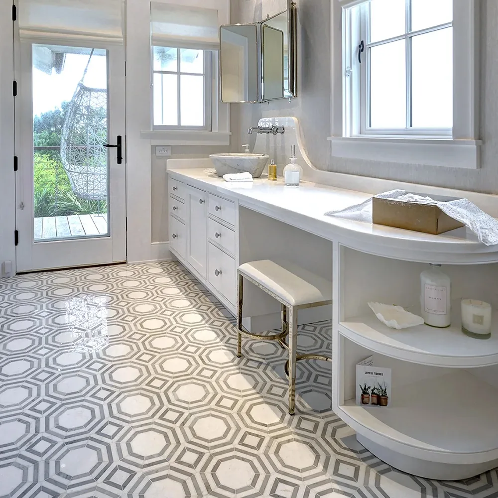 Custom white bath vanity and built-in shelving by Hostetler Custom Cabinetry