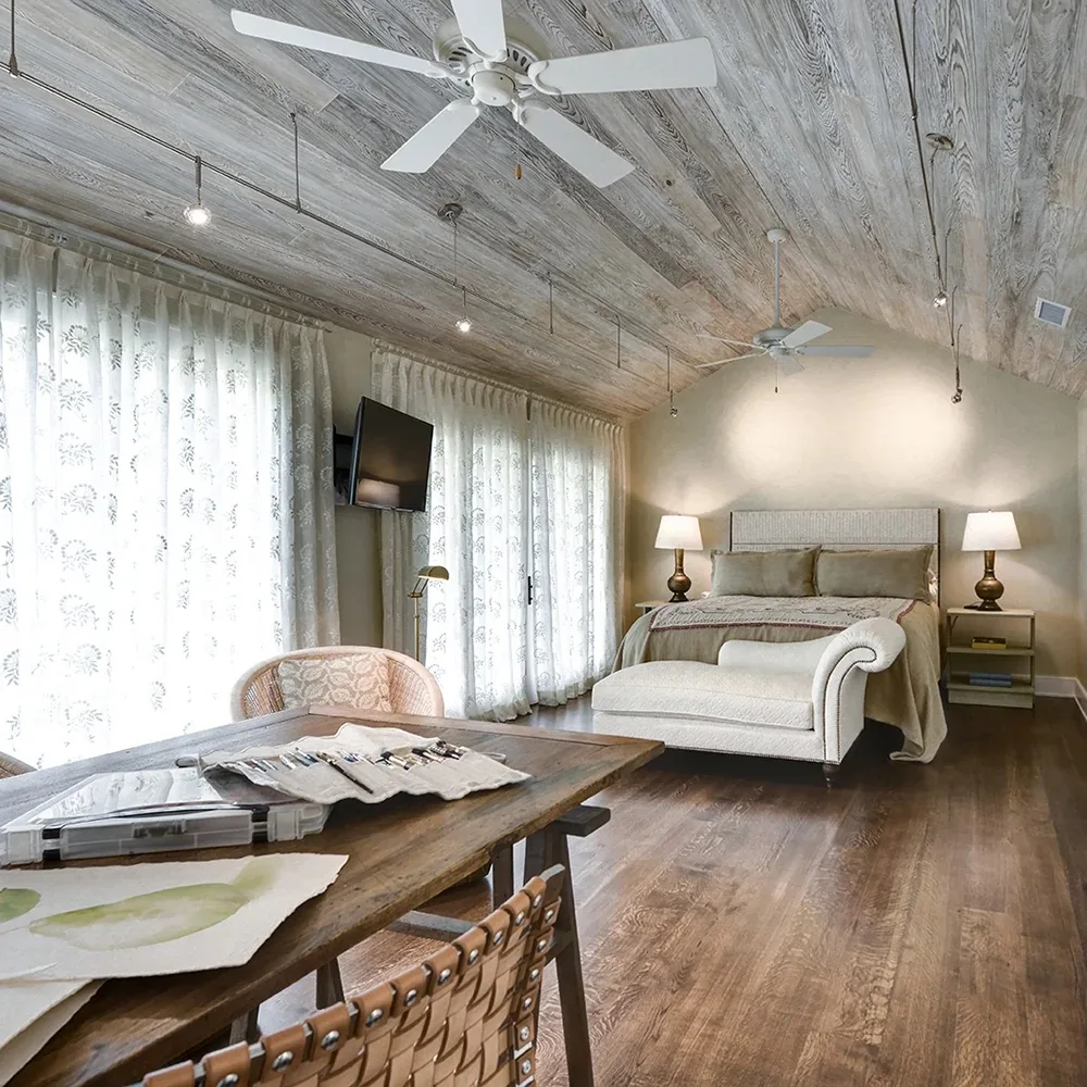 Custom bedroom woodwork with paneled ceiling by Hostetler Custom Cabinetry