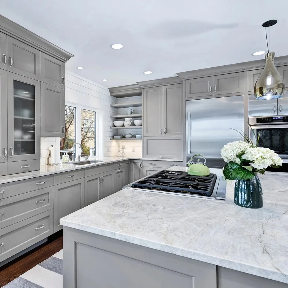Grey custom kitchen cabinetry with marble island by Hostetler Custom Cabinetry
