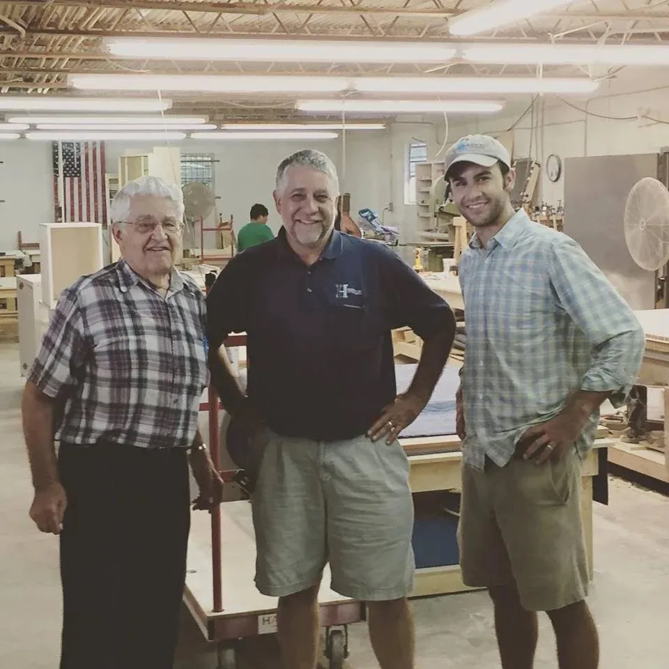 The Hostetler family in the cabinet shop